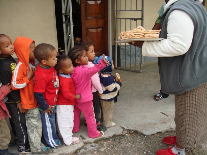 Food being distributed to the children at a soup kitchen in Sir Lowry’s Pass